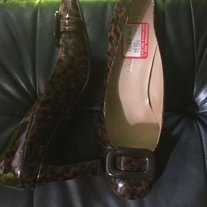 Leopard heels. Never worn.